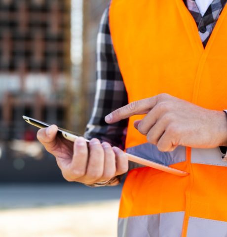 close-up-construction-engineer-using-tablet (Medium)